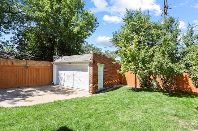 garage featuring a yard