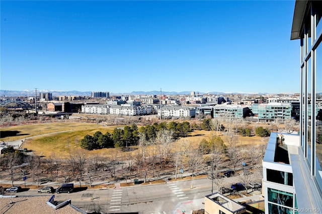 property's view of city featuring a mountain view