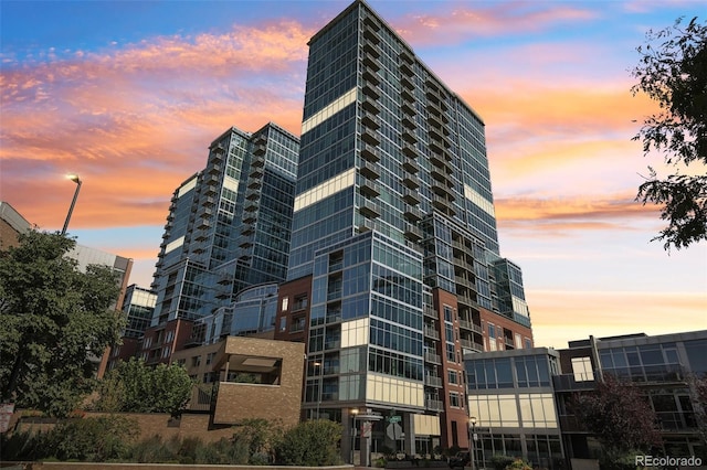 view of outdoor building at dusk