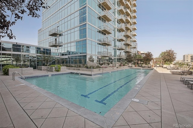 view of pool featuring a patio area