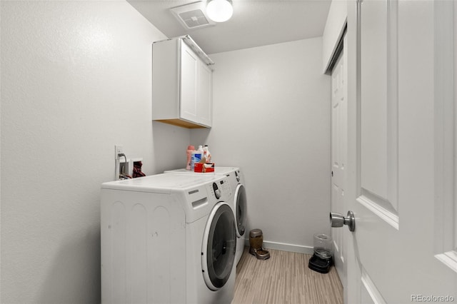5744 Alton St, Denver, CO 80238 - laundry room featuring washer and dryer, wood finished floors, cabinet space, and baseboards