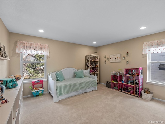 bedroom featuring recessed lighting, light carpet, and baseboards