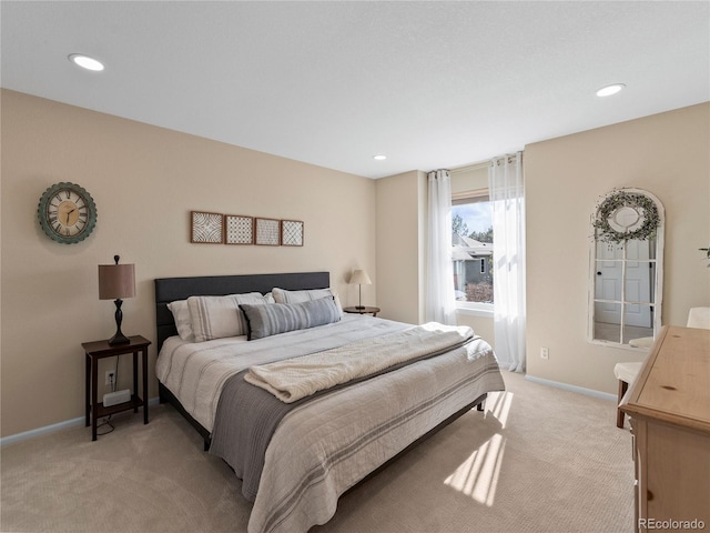 bedroom featuring recessed lighting, light colored carpet, and baseboards