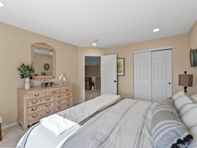 bedroom with recessed lighting, a closet, light carpet, and baseboards