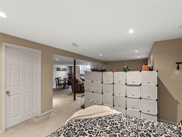 interior space with recessed lighting, light colored carpet, and baseboards