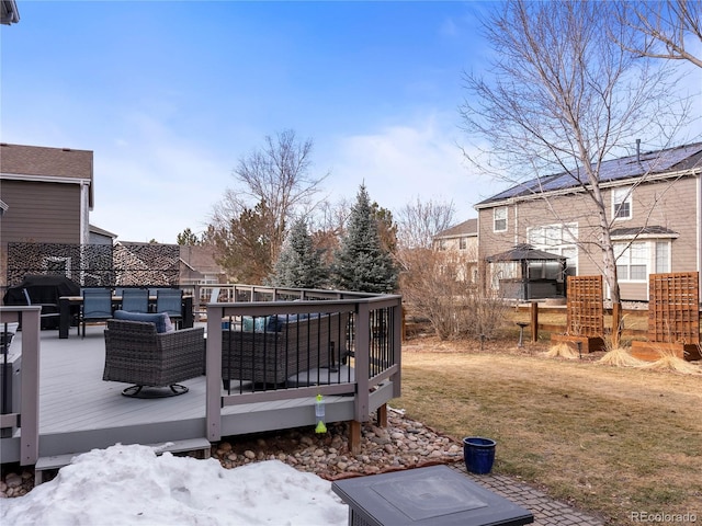 wooden deck with a grill and a gazebo