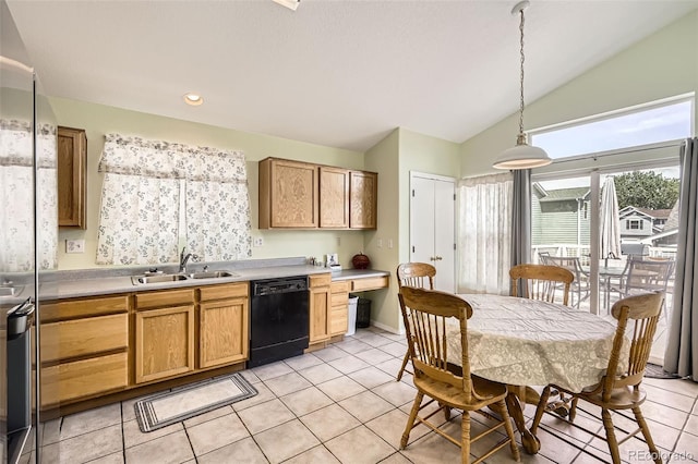 9882 Harris St, Thornton, CO 80229 - kitchen featuring black dishwasher, lofted ceiling, light tile patterned floors, light countertops, and pendant lighting