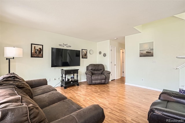 9882 Harris St, Thornton, CO 80229 - living area featuring light wood-style flooring and baseboards