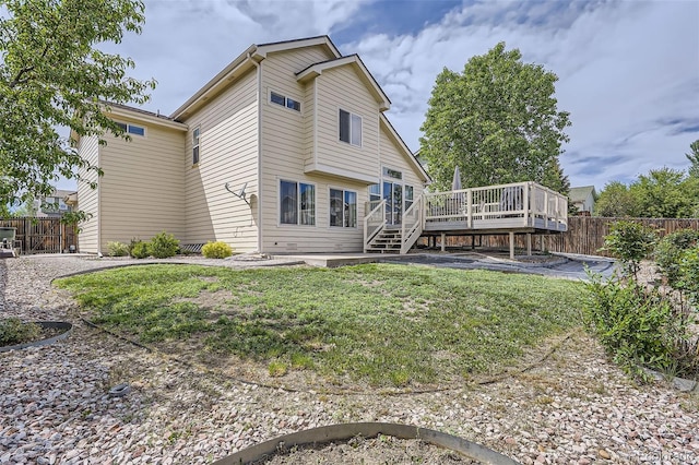 9882 Harris St, Thornton, CO 80229 - rear view of property featuring a wooden deck and stairs