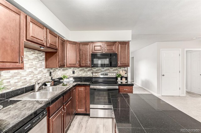 4784 S Tabor St, Morrison, CO 80465 - kitchen featuring appliances with stainless steel finishes, decorative backsplash, tile counters, and brown cabinets