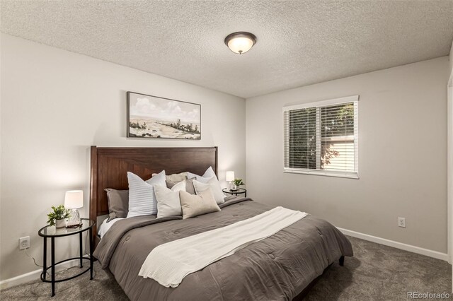 4784 S Tabor St, Morrison, CO 80465 - carpeted bedroom with baseboards and a textured ceiling