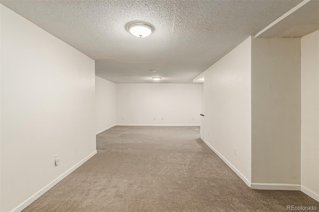 4784 S Tabor St, Morrison, CO 80465 - finished below grade area with carpet flooring and a textured ceiling