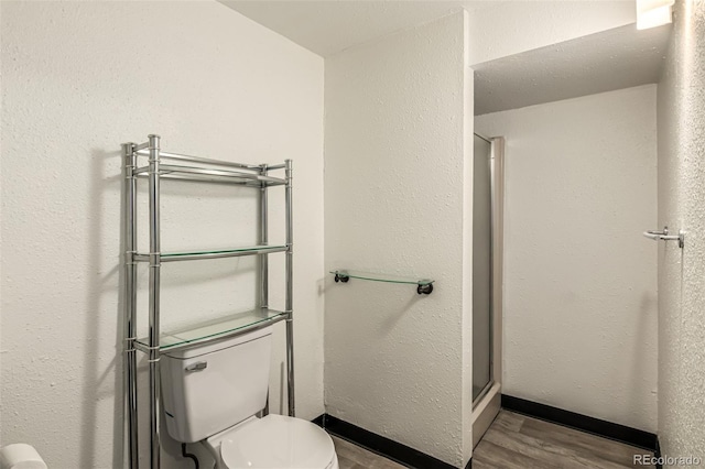4784 S Tabor St, Morrison, CO 80465 - bathroom with wood finished floors and a stall shower