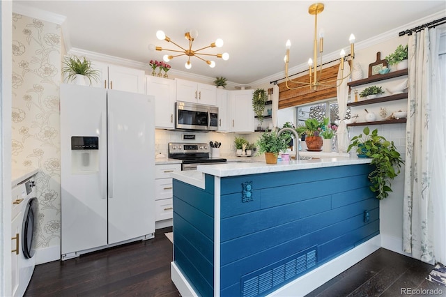 9620 W Chatfield Ave Unit D, Littleton, CO 80128 - kitchen featuring stainless steel appliances, open shelves, a chandelier, washer / dryer, and white cabinetry