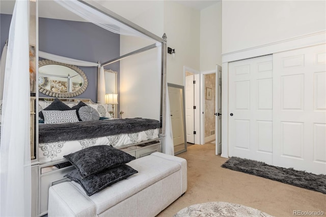9620 W Chatfield Ave Unit D, Littleton, CO 80128 - carpeted bedroom with a closet and a towering ceiling