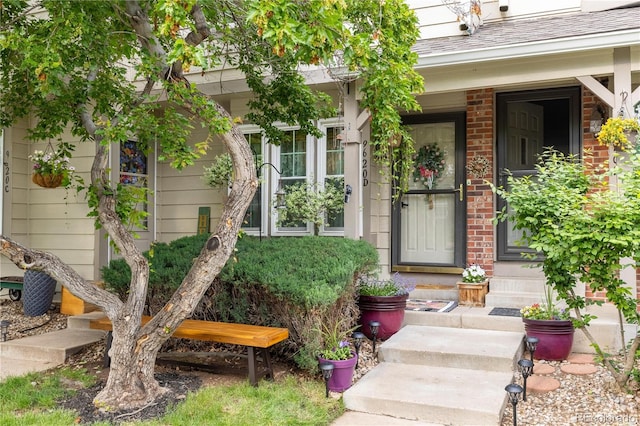 9620 W Chatfield Ave Unit D, Littleton, CO 80128 - doorway to property with brick siding