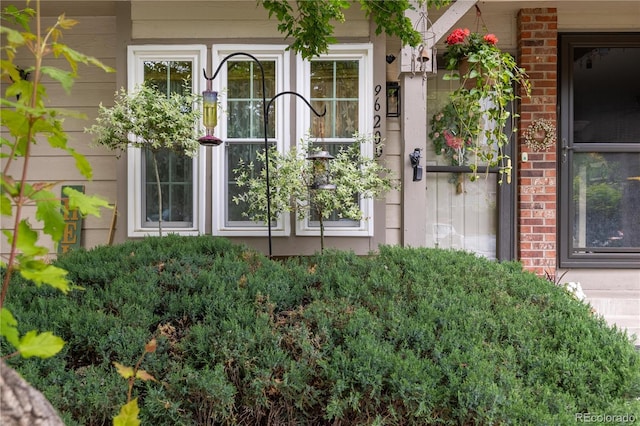 9620 W Chatfield Ave Unit D, Littleton, CO 80128 - doorway to property featuring brick siding