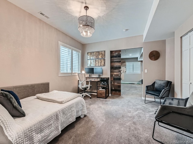 2896 Gemini Loop, Broomfield, CO 80023 - carpeted bedroom featuring a desk and a chandelier