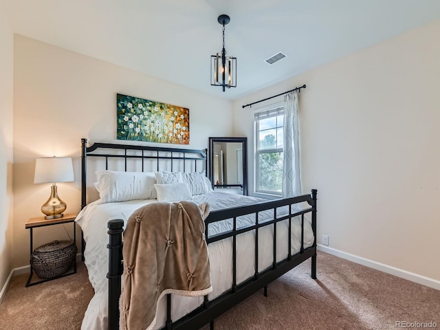 2896 Gemini Loop, Broomfield, CO 80023 - carpeted bedroom featuring baseboards and a chandelier