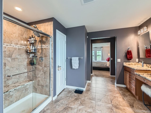 2896 Gemini Loop, Broomfield, CO 80023 - ensuite bathroom with vanity, a stall shower, and baseboards