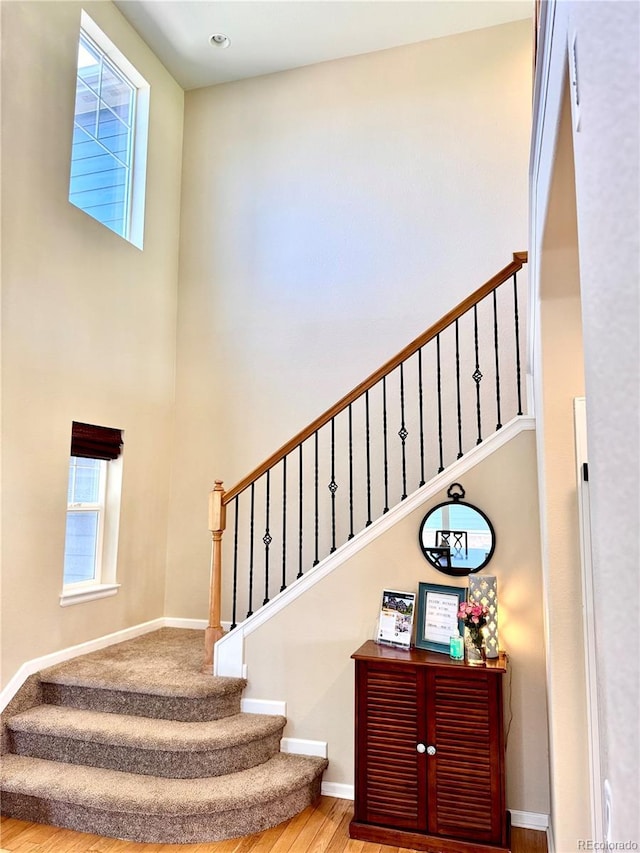 2896 Gemini Loop, Broomfield, CO 80023 - stairs featuring wood finished floors and a high ceiling