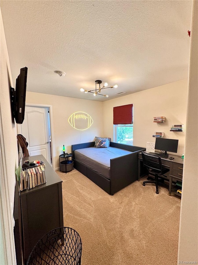 2896 Gemini Loop, Broomfield, CO 80023 - carpeted bedroom featuring a desk, a textured ceiling, and a chandelier