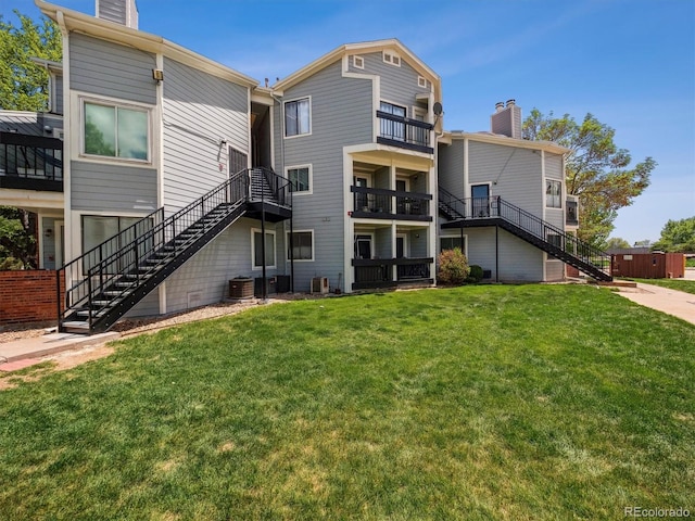 view of property with stairs and central air condition unit