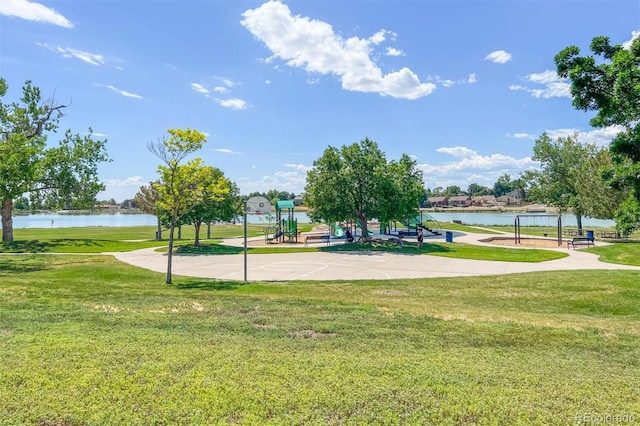 view of home's community with a yard and a water view