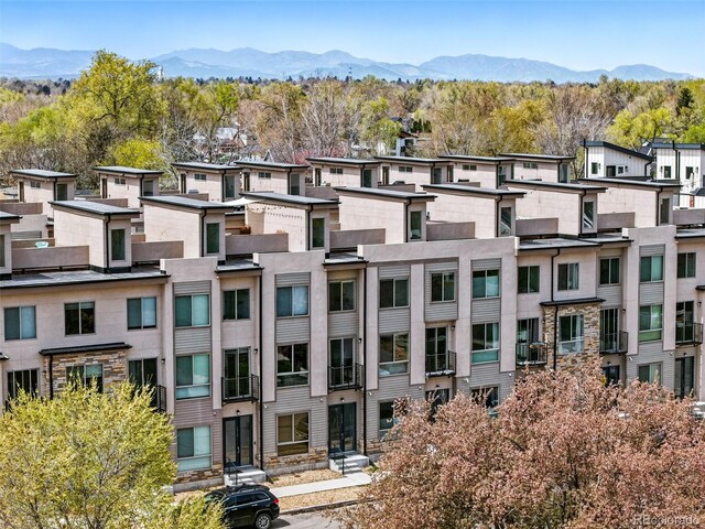 view of property featuring a mountain view and a residential view