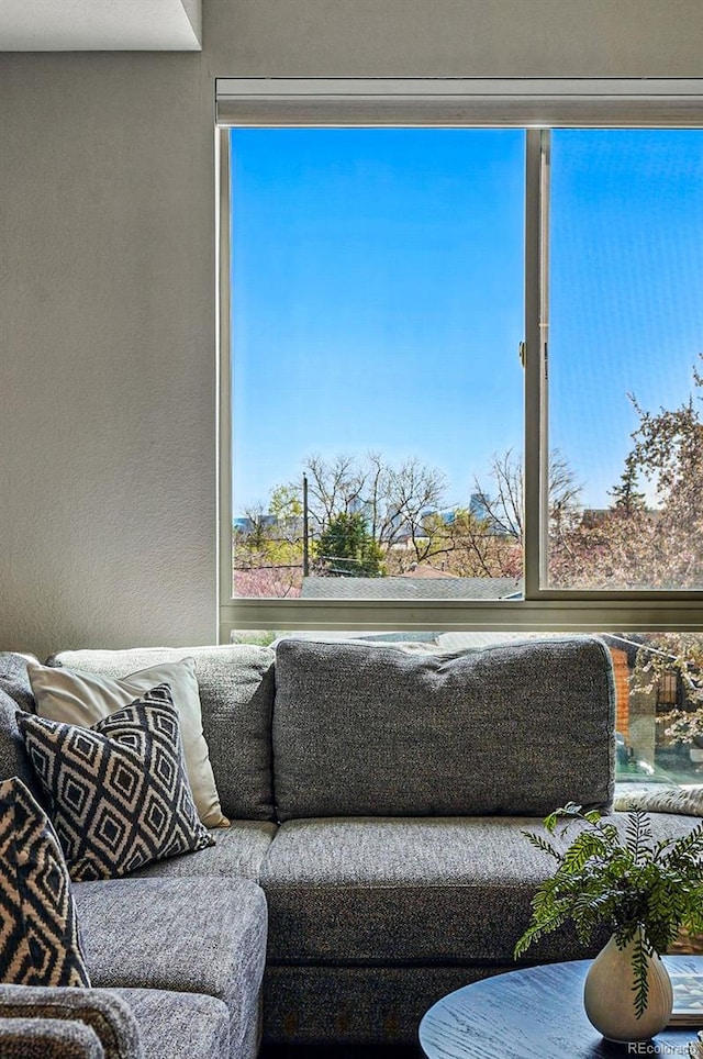 living area with a textured wall