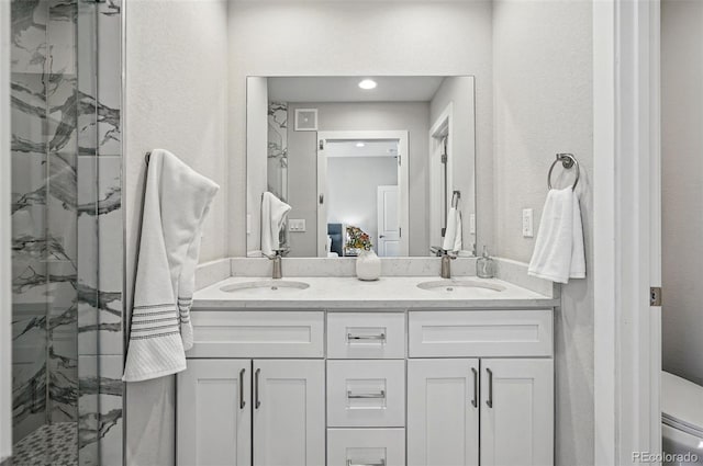 ensuite bathroom with a sink, a marble finish shower, and ensuite bath