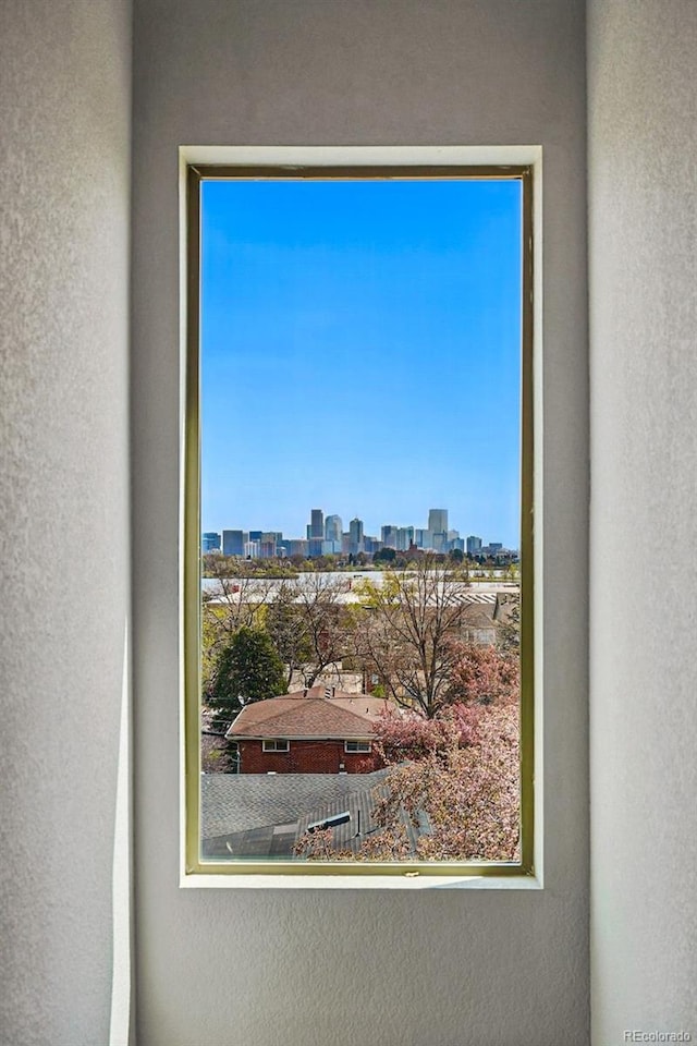 room details featuring a city view and a textured wall