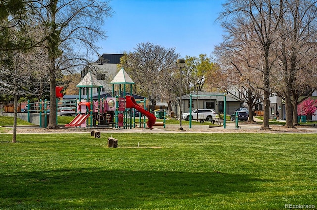 communal playground featuring a yard