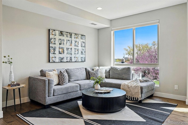 living room with baseboards, recessed lighting, wood finished floors, and visible vents