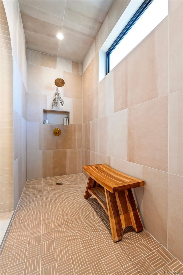 bathroom with tiled shower