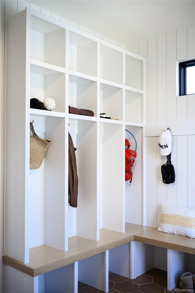 mudroom featuring dark tile patterned flooring