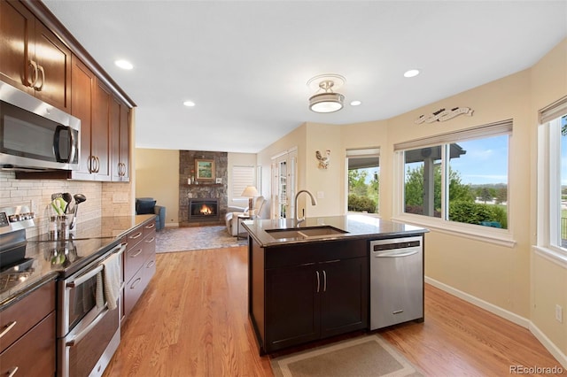 8040 W 78th Cir, Arvada, CO 80005 - kitchen featuring appliances with stainless steel finishes, a sink, healthy amount of natural light, and recessed lighting