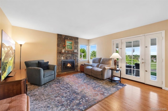 8040 W 78th Cir, Arvada, CO 80005 - living room with wood finished floors and a fireplace