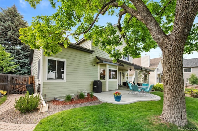 8040 W 78th Cir, Arvada, CO 80005 - rear view of property with a patio area and a gate