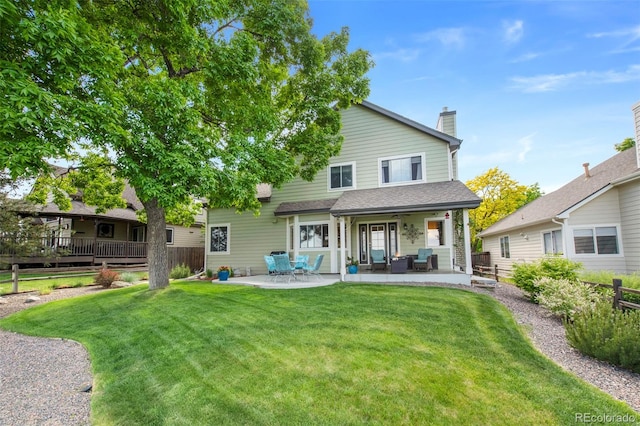 8040 W 78th Cir, Arvada, CO 80005 - back of house featuring a patio and a chimney