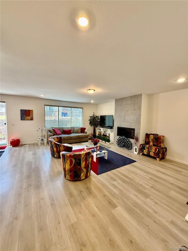 27580 E Cedar Pl, Aurora, CO 80018 - living area featuring wood finished floors, a fireplace, and recessed lighting