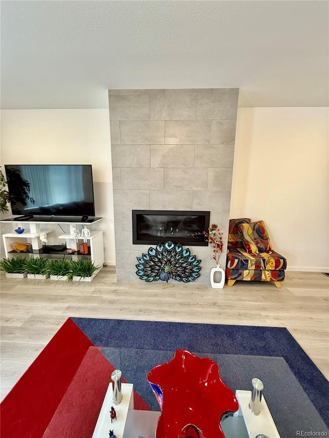 27580 E Cedar Pl, Aurora, CO 80018 - living room featuring a fireplace and wood finished floors