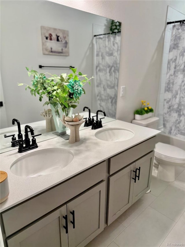 27580 E Cedar Pl, Aurora, CO 80018 - full bath featuring double vanity, tile patterned flooring, and shower / tub combo