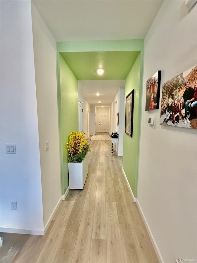 27580 E Cedar Pl, Aurora, CO 80018 - hallway featuring light wood-style floors and baseboards