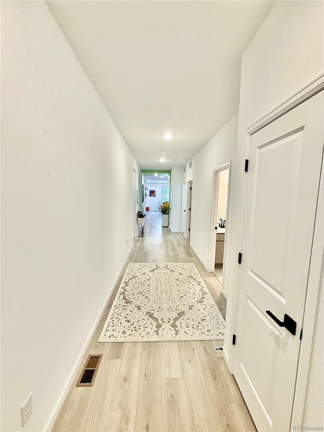 27580 E Cedar Pl, Aurora, CO 80018 - corridor featuring light wood-style floors and baseboards
