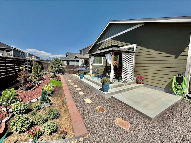 27580 E Cedar Pl, Aurora, CO 80018 - fenced backyard featuring a gazebo and a patio area