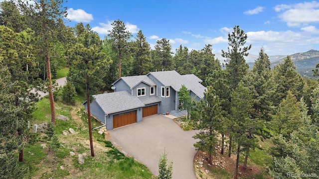 6637 Berry Bush Ln, Evergreen, CO 80439 - view of subject property with a forest