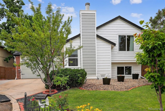 1102 Conifer Ct, Highlands Ranch, CO 80126 - back of property featuring a yard, driveway, a chimney, and a garage