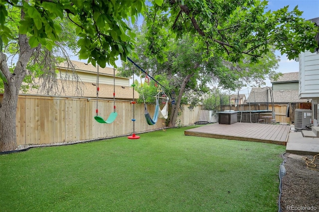 1102 Conifer Ct, Highlands Ranch, CO 80126 - fenced backyard with a wooden deck and a trampoline
