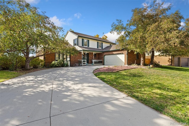 front of property with a front lawn and a garage